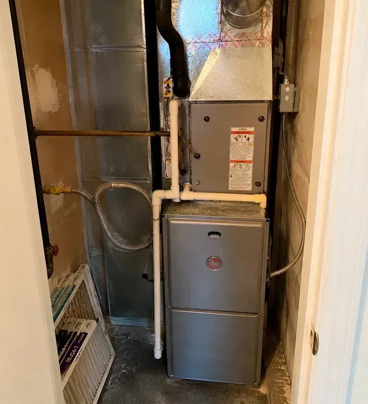 New high-efficiency furnace and heating system installed in a utility closet in Agoura Hills, California. Professional HVAC installation with proper ductwork and ventilation.