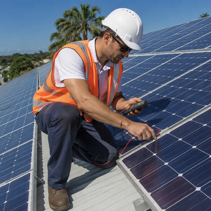 Professional technician performing maintenance and repair on rooftop solar panels in Los Angeles, CA. Expert solar system service and diagnostics.