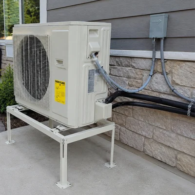 Hybrid heat pump system outdoor unit installed outside a residential home in Los Angeles, California.